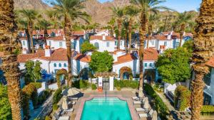 an aerial view of a resort with a pool and palm trees at SV006 Secluded Spa Villa Studio at LQ Resort in La Quinta