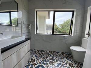 Ένα μπάνιο στο Auckland One Tree Hill Coby Suite