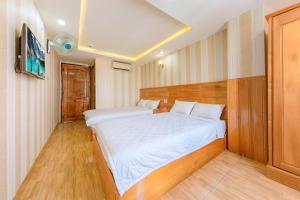 Giường trong phòng chung tại Odessa hotel