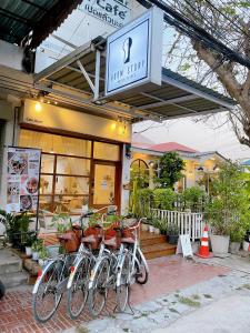 a group of bikes parked in front of a store at Room Story Hostel in Phra Nakhon Si Ayutthaya