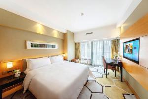 TV a/nebo společenská místnost v ubytování Hampton by Hilton Zhuhai Gongbei Port + 19 fotografií