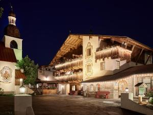 a large building with a tower and a church at Hotel Pension Anna in Leavenworth