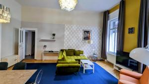 a living room with a couch and a table at Great Synagogue Apartment, 2 separate bedrooms, 5 guests, Fast Wifi,AC in Budapest