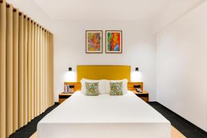 Postel nebo postele na pokoji v ubytování Keys Prima By Lemon Tree Hotels, Thekkady