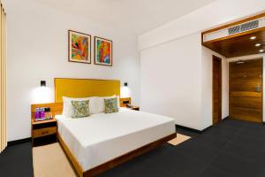 Postel nebo postele na pokoji v ubytování Keys Prima By Lemon Tree Hotels, Thekkady