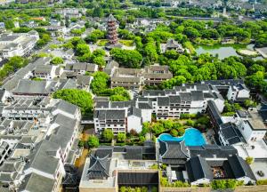 an aerial view of a city with buildings at Pan Pacific Suzhou in Suzhou