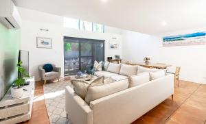 a living room with a couch and a table at Peppi Lane Stay in Margaret River Town