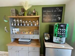a coffee shop with a coffee machine on a shelf at Europa Hotel City in Saarbrücken +37 photos