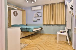 a hospital room with a bed and a table at Apollo 4 - Luxury Apartment (City Center Studio) in Katerini