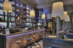 a bar at a restaurant with stools at The Inn on the Mile in Edinburgh