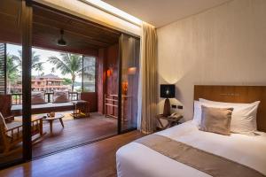 Voodi või voodid majutusasutuse Hansar Samui Resort & Spa - SHA Extra Plus toas