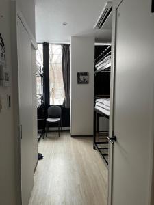 an open door to a room with bunk beds at Q FOX BLACK DIAMOND HOTEL in Niseko