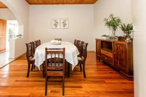 a dining room with a table and chairs at Kammanassie Farmstay in Laudina