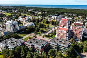 an aerial view of a city with buildings and the ocean at Ramaus Poilsio Apartamentai in Palanga