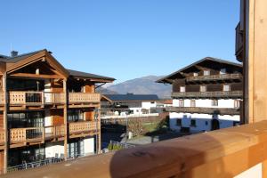 a view of buildings with mountains in the background at Apartment Adler Resort by Alpin Rentals in Kaprun