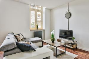 Μια τηλεόραση ή/και κέντρο ψυχαγωγίας στο Appartement Le Somptueux Bressan - Hyper-Centre