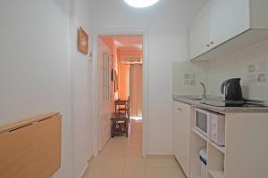 A kitchen or kitchenette at Andromaches large apartment 2