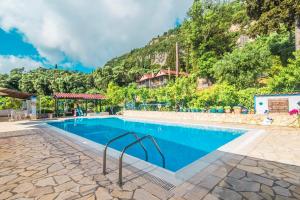 The swimming pool at or close to Andromaches large apartment 2