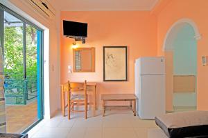 A television and/or entertainment centre at Andromaches large apartment 2