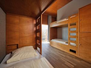 a bedroom with two bunk beds and a window at Youth Hostel Schengen / Remerschen in Remerschen