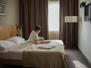 Postel nebo postele na pokoji v ubytování Terme Tuhelj Hotel Well