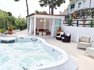 a hot tub on the patio of a house at Residence Maresol in Vieste