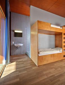 a bedroom with a bunk bed and a sink at Youth Hostel Schengen / Remerschen in Remerschen