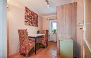 a dining room with a table and chairs at Nice Apartment In Niederndorferberg With Kitchen in Niederndorferberg