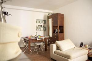 a living room with a couch and a dining room table at A Casa di Irene in Como
