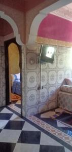 a room with a tv in a doll house at Dar LBAHJA 3 in Ouzoud