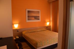 Postel nebo postele na pokoji v ubytování Hotel I Cedri
