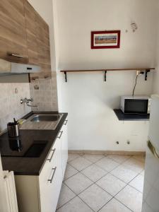 A kitchen or kitchenette at Residence Hotel Vittoria