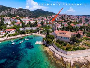 an aerial view of a city with boats in the water at Lina Vranković Apartments in Hvar