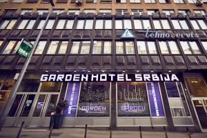 a building with a sign on the front of it at Hotel Srbija Garden Ex Garni in Belgrade