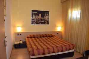 Postel nebo postele na pokoji v ubytování Hotel I Cedri