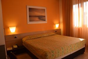 Postel nebo postele na pokoji v ubytování Hotel I Cedri