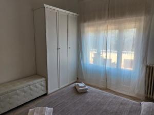A bed or beds in a room at Residence Hotel Vittoria