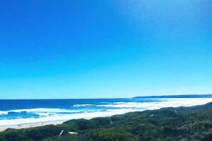 a view of the ocean and a beach at Spindrift Seaside Accommodation in Wilderness