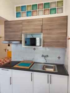 A kitchen or kitchenette at Residence Hotel Vittoria