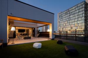 a balcony with a view of a building at Tokyu Stay Shinjuku Eastside in Tokyo