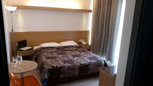 Postel nebo postele na pokoji v ubytování Kyridis Hotel