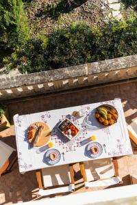 a table with plates of food on top of it at Finca Ceguer MHM in Font de Sa Cala