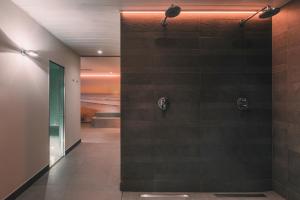 Een badkamer bij Boutique Hotel 'Hof ter Duinen'