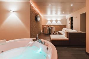 Een bed of bedden in een kamer bij Boutique Hotel 'Hof ter Duinen'