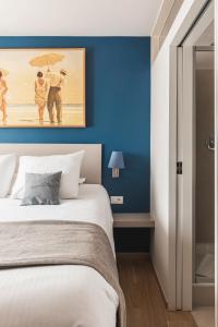 Een bed of bedden in een kamer bij Boutique Hotel 'Hof ter Duinen'