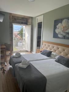 Postel nebo postele na pokoji v ubytování Pazo Pias P