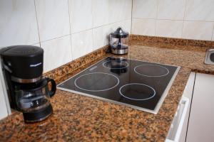 A kitchen or kitchenette at A Casiña de Juan