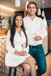 a man and a woman posing for a picture at Boutique Hotel 'Hof ter Duinen' in Oostduinkerke