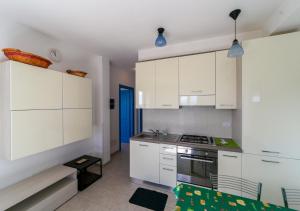 A kitchen or kitchenette at LA DOMIZIANA