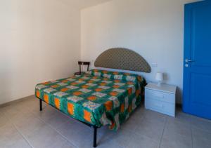 A bed or beds in a room at LA DOMIZIANA